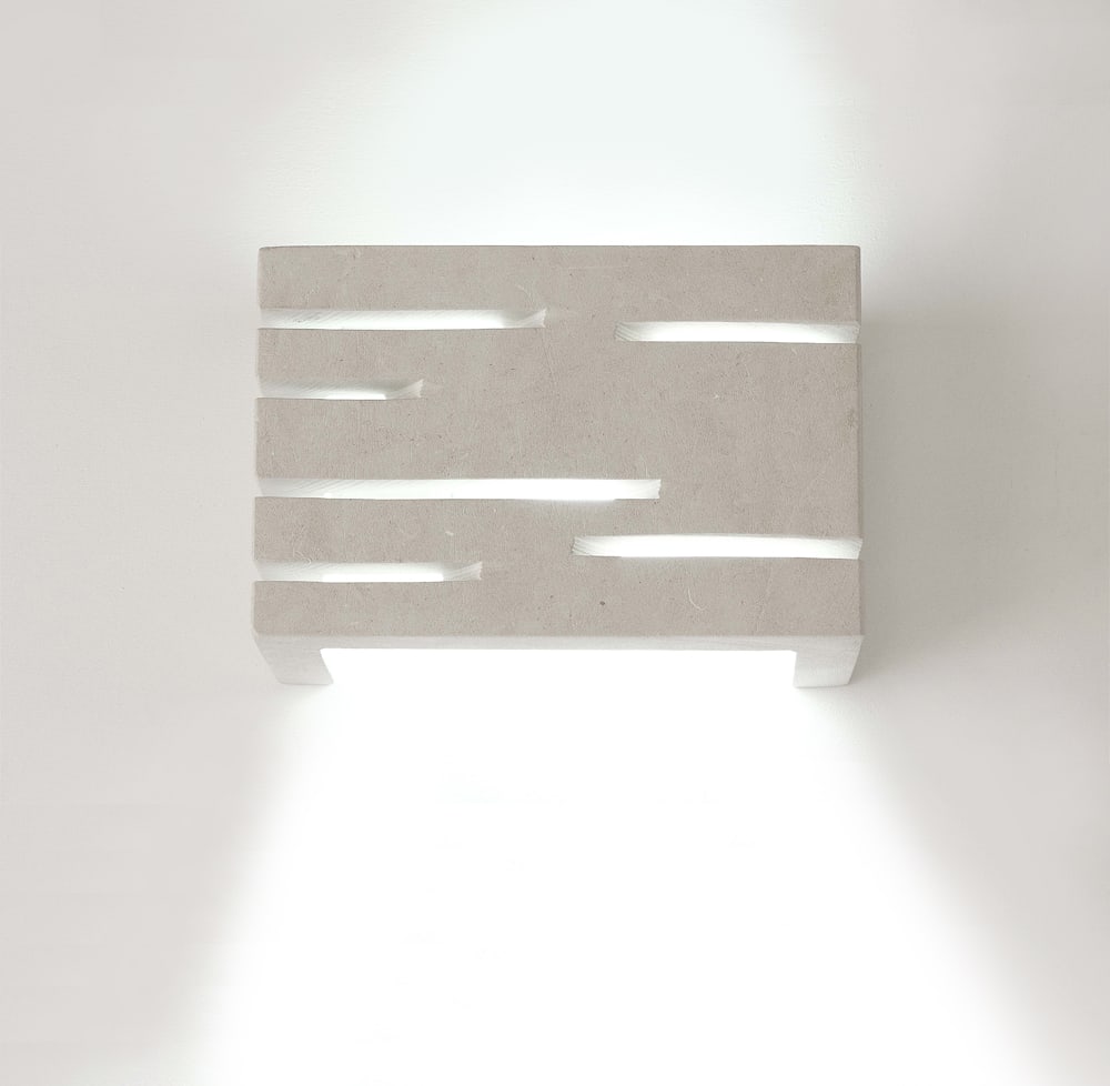 Wall sconces with horizontal cuts in stone